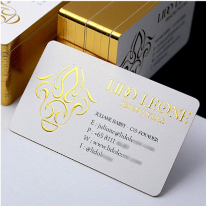 A premium embossed business card with gold foil accents, featuring intricate designs and professional contact details, providing a sophisticated branding solution.