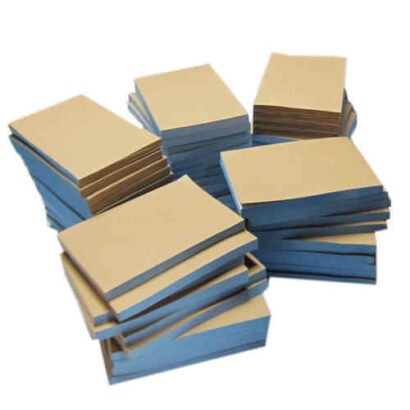 A stack of invoice books with blue and beige pages, ideal for businesses to record transactions and maintain financial documentation efficiently.