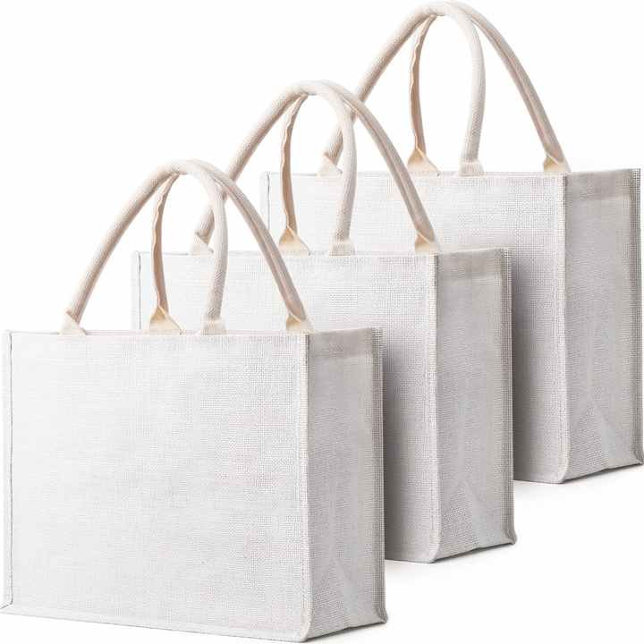 A set of elegant white jute tote bags with durable beige handles, featuring a smooth and minimalist design. These reusable bags are ideal for shopping, gifting, or everyday use.