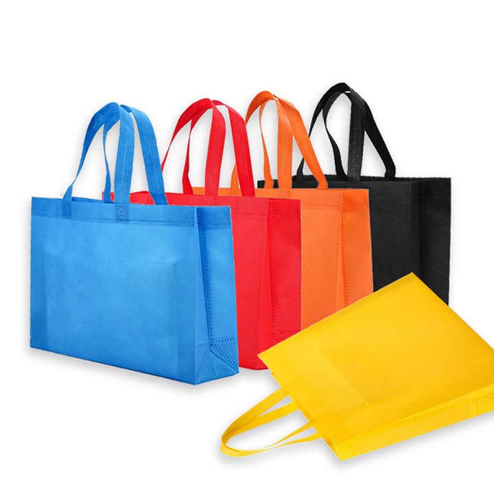 A collection of colorful non-woven shopping bags with sturdy handles, featuring vibrant colors including blue, red, orange, black, and yellow. These bags can be customized with printed logos, making them ideal for branding and eco-friendly shopping.