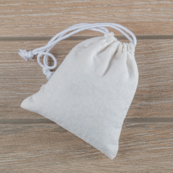 A pure cotton drawstring pouch in white, ideal for eco-friendly packaging of small items, gifts, and accessories.